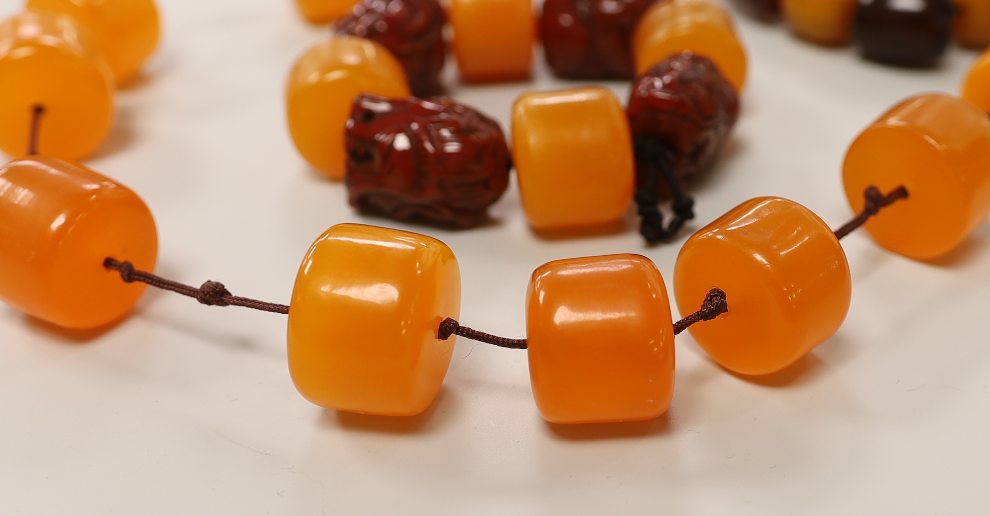 Three assorted amber items